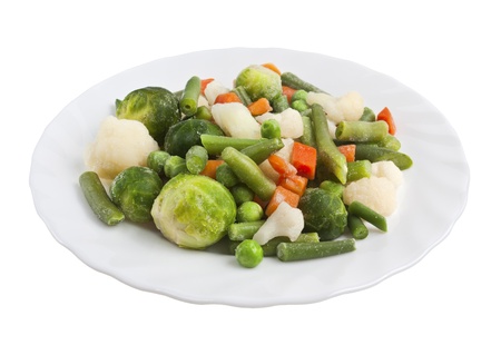 Fresh chopped vegetables on a plate isolatedの写真素材