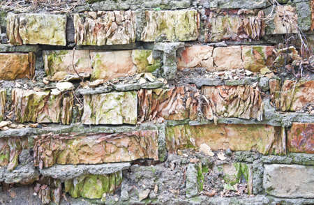 Texture of an old ruined red brick wall