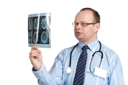 The doctor looks on the image tomography of the brain isolated