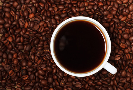 Cup of coffee and coffee beans. Top viewの写真素材