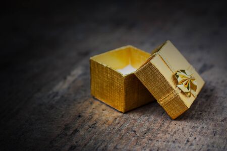 Open gift close-up on a wooden surfaceの写真素材
