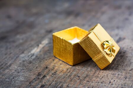 Open gift close-up on a wooden tableの写真素材