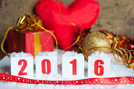 Greeting card 2016 with New Year gifts and snowの写真素材