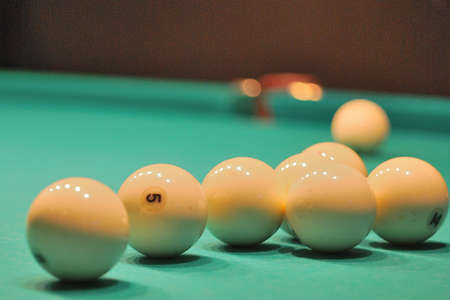 Billiard balls to number five in the professional game