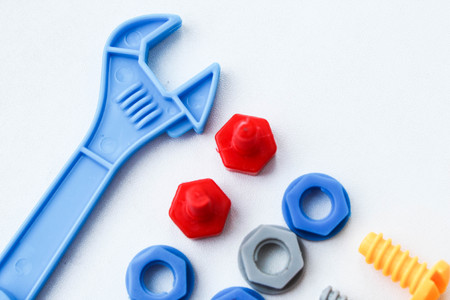 Children's plastic multi-colored toy bolts and nuts. A set of construction hardware for children.の写真素材