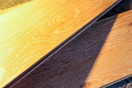 Samples of laminate and parquet board. Selection and types of floor coverings.
