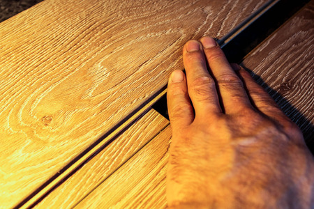 Samples of laminate and parquet board. Selection and types of floor coverings.