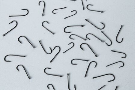 Fishing hooks on a white background.の写真素材