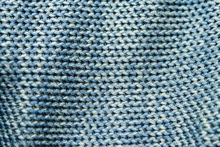 Embroidered fabric texture in blue.