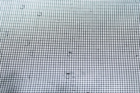 Mosquito net vokon frame with raindrops.の写真素材