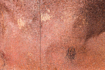 Rusty barrel texture. An empty metal barrel is covered in rust.