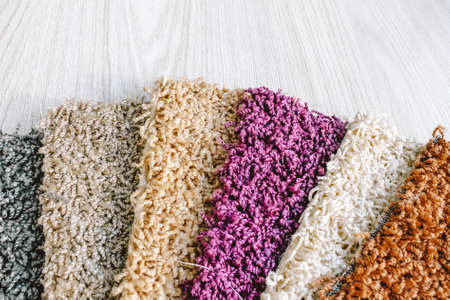 Samples of carpet with a long pile in a bundle. Examples of multi-colored carpet in a swatch.の写真素材