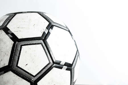 Dirty soccer ball close-up on a white background.の写真素材