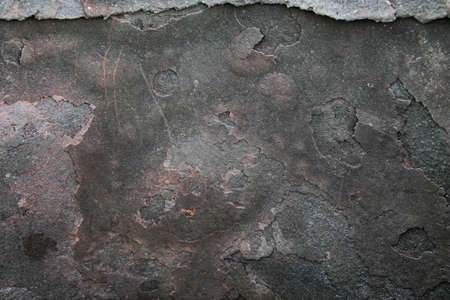 Burnt metal. Soot and fumes on a metal barrel. Black soot after a fire.