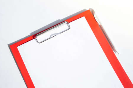 Plastic tablet with a white sheet of paper on a white background. View from above. Object acceptance sheet. Patient's consent to surgery. Check mark done and accepted. Yes and no, choice.の写真素材