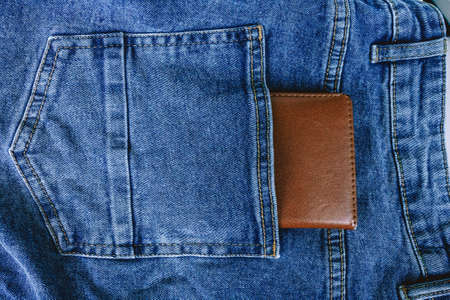 Wallet in your pocket. Wallet for storing cards and business cards in your jeans pocket. Money in...