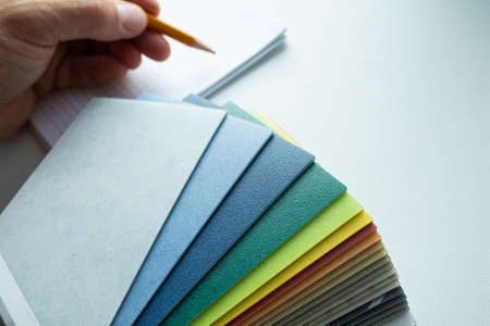 Choice of flooring. Samples of linoleum in different colors. Chopped linoleum into pieces. Swatch with samples of linoleum. Floor coverings design. Office and household linoleum with wood texture.の写真素材