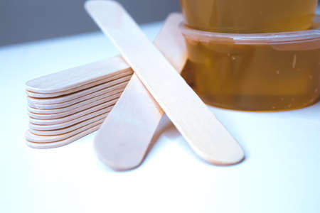 Spatula and sugar for hair removal. Shugaring set. Hair removal with sugar. Sugar paste for depilation.の写真素材