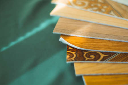 A piece of linoleum for samples. Sliced wood grain linoleum.