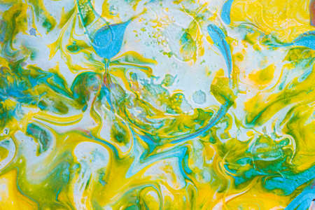 Abstract background from spilled paints. Multi-colored paints on canvas.の写真素材