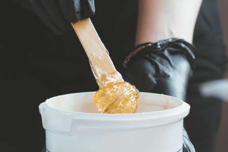 Shugaring master. Sugar paste for depilation. Intimate hygiene. Smooth skin.の写真素材