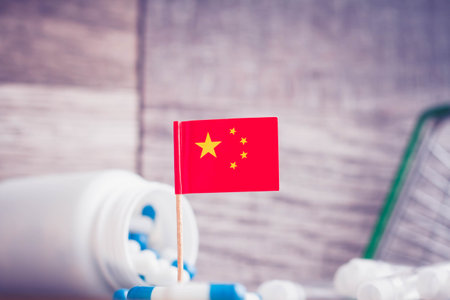 Medicines in china. Country flag and pills close up.の写真素材
