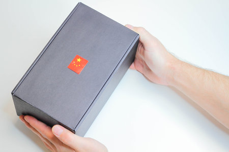 Post from China. Receiving a parcel. Box with the Chinese flag.の写真素材