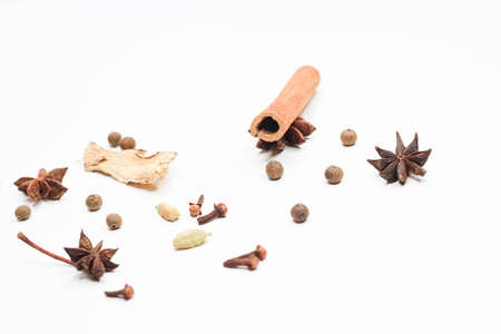 Mulled wine set. A set of spices for mulled wine on a white background. Raisins, ginger, cinnamon,...