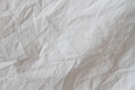 Wrinkled sheet. White fabric close-up. Burlap texture. Sheet on the bed. White crumpled background.の写真素材