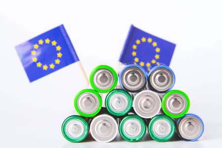 battery. AA lot of batteries on the background of the flag of the European Union. Alkaline and...