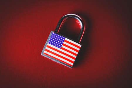 US sanctions. Closed padlock with USA flag. Cancellation of deliveries of products from America. Supply ban.の写真素材