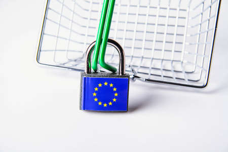 EU sanctions. Closed padlock with european union flag. Cancellation of deliveries of products from the European Union. Sanctions basket. Closing deliveries to European countries.の写真素材