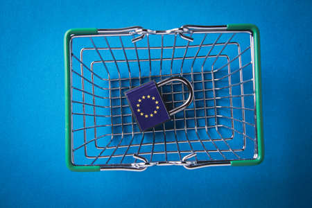 EU sanctions. Closed padlock with european union flag. Cancellation of deliveries of products from the European Union. Sanctions basket. Closing deliveries to European countries.の写真素材