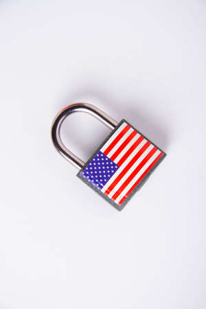 US sanctions. Closed padlock with USA flag. Cancellation of deliveries of products from America. Supply ban.の写真素材