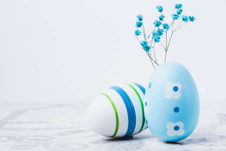Easter. multicolored eggs. Yellow and blue Easter decorations. Christian holiday in honor of the...