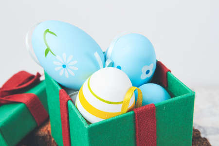 Easter. multicolored eggs. Yellow and blue Easter decorations. Christian holiday in honor of the...