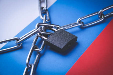 Flag of Russia and a chain with a lock. country blocking. Prohibited. The imposition of sanctions....