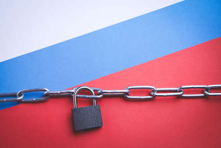 Flag of Russia and a chain with a lock. country blocking. Prohibited. The imposition of sanctions. closed area.の写真素材