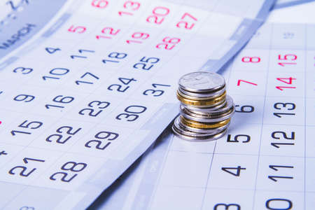 budget planning. money and calendar. Salary and advance. receiving a profit. Spending schedule for the year. Annual and monthly budget. Analysis and statistics of expenses.の写真素材