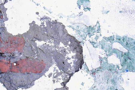 cracked paint texture. Grunge wall texture. Dark wall with old paint. The wall is crumbling with...