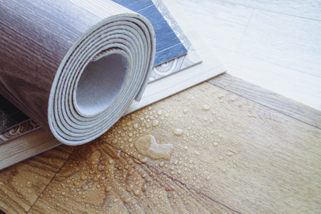 Waterproofness of linoleum. Protection of floor coverings from moisture. Waterproof linoleum in the kitchen. sample roll.の写真素材