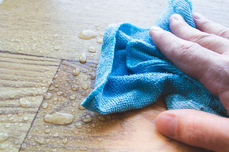 Waterproofness of linoleum. Protection of floor coverings from moisture. Waterproof linoleum in the kitchen. sample roll.の写真素材