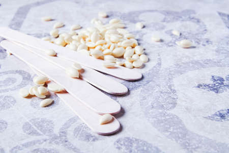 Wax hair removal. Hair removal with wax. Shugaring with sugar paste. Wax granules close-up.の写真素材
