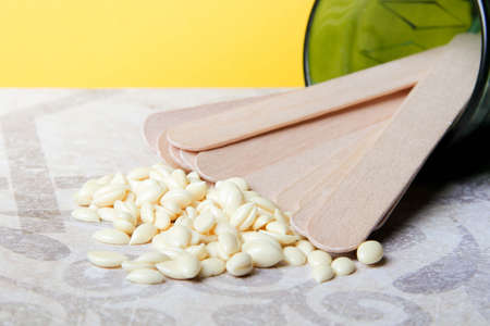 Wax hair removal. Hair removal with wax. Shugaring with sugar paste. Wax granules close-up.の写真素材