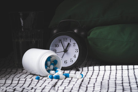 Time to take your medicine. Pill reminder. Tablets and alarm clock. Notification of the doctor about the prevention of the disease.の写真素材