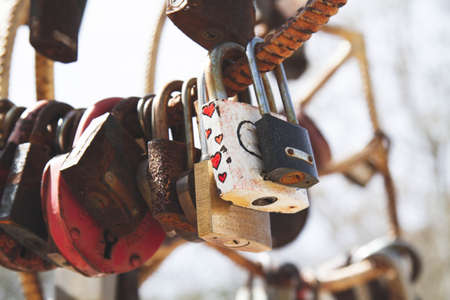 Old padlock. Door lock in the form of a heart.の写真素材