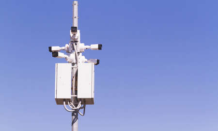 Surveillance Camera. tracking a person. Pursuit and search. Camera on the street. Protection of the object on the territory.の写真素材