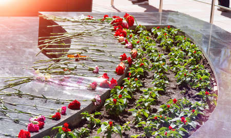 Commemorative memorial. Laying flowers at the eternal fire. Tribute to the memory of the fallen...