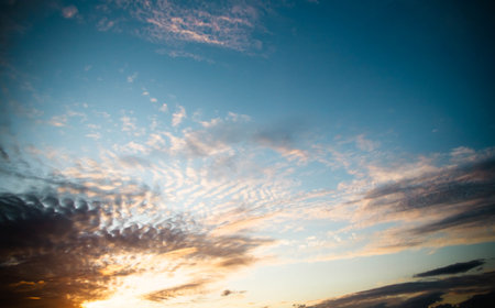 Golden sunset on dark background. space background. natural beauty. Sunset sky clouds background. Dramatic background.の写真素材