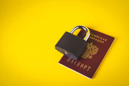 country blocking. Restriction of travel around the world for Citizens of Russia. Prohibition of registration of Russian users. Passport of the Russian Federation and a lock.の写真素材